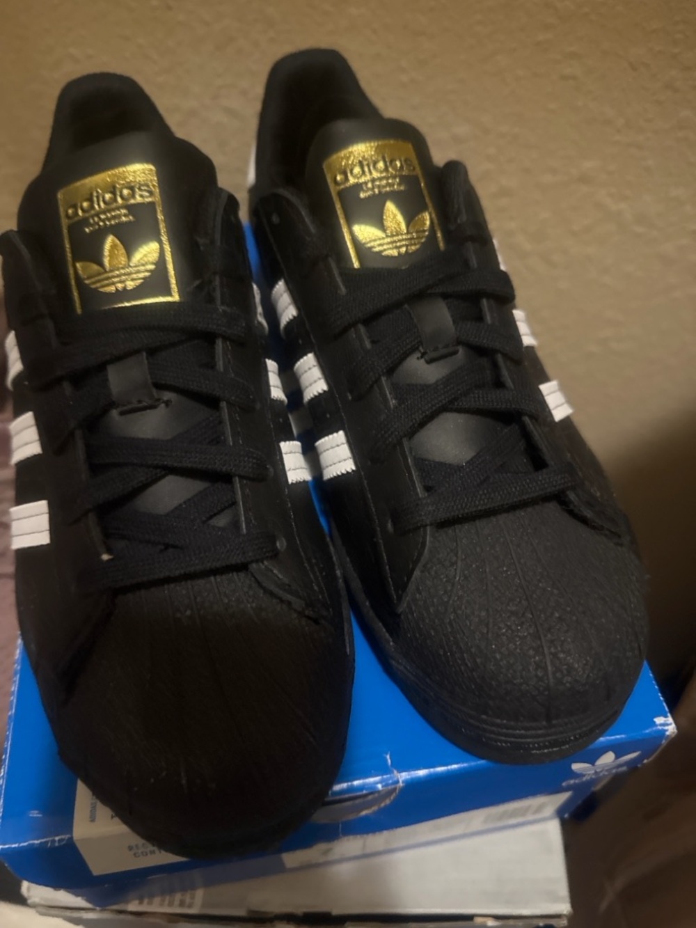 adidas Black Superstar  with White Stripes and Gold Tongue Accent